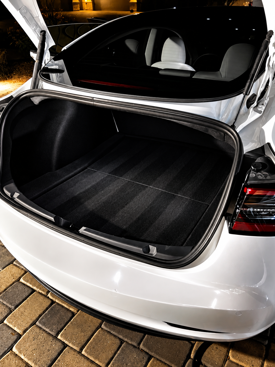 Freshly detailed, spotless black trunk carpet